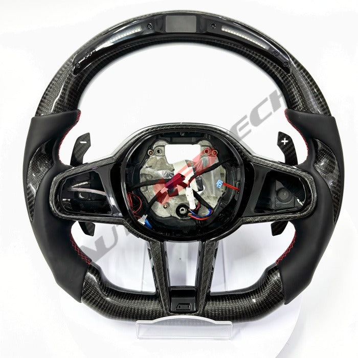 BMW G-Series magnetic paddle shifters installed on carbon fiber LED steering wheel