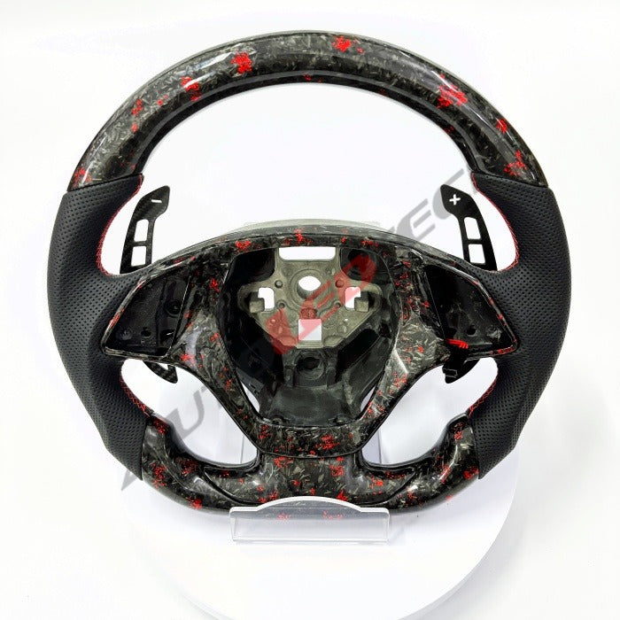 C7 Corvette magnetic paddle shifters installed on forged carbon steering wheel