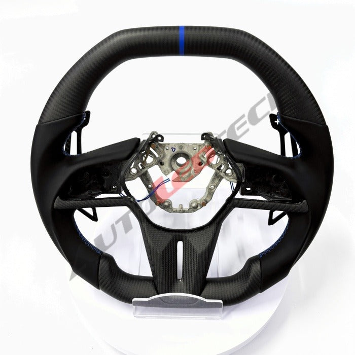 Nissan magnetic carbon fiber paddle shifters installed on carbon fiber steering wheel