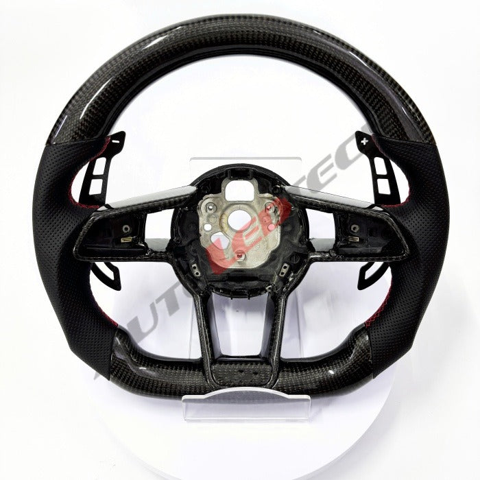 Audi R8 magnetic paddle shifters installed on carbon fiber steering wheel