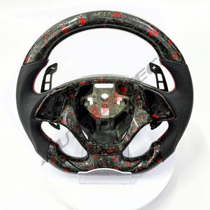 C7 Corvette magnetic paddle shifters installed on forged carbon steering wheel