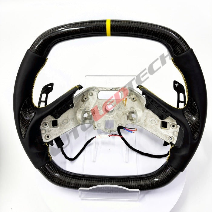 C8 Corvette magnetic paddle shifters installed on carbon fiber steering wheel
