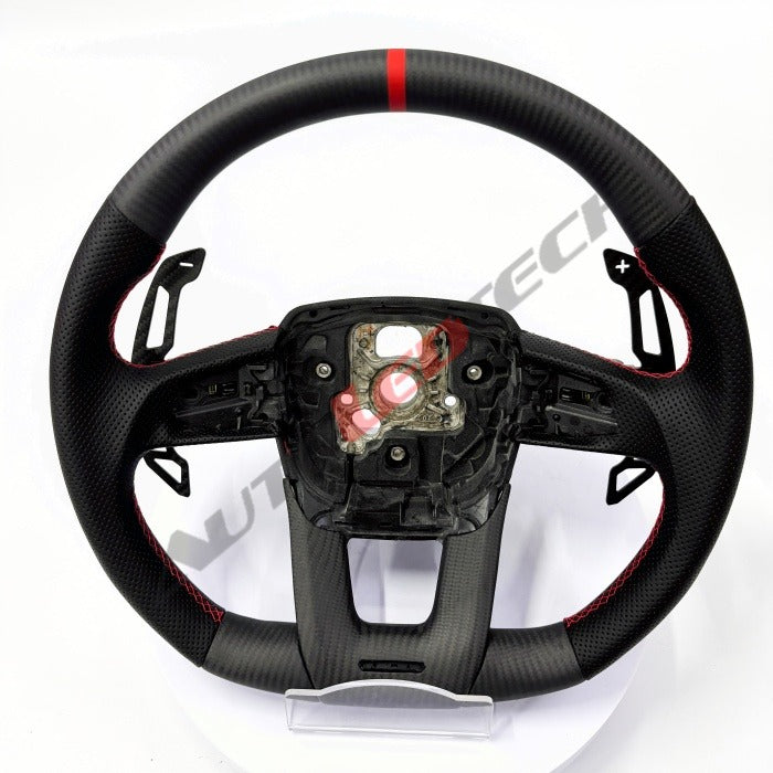Lamborghini Urus magnetic paddle shifters installed on carbon fiber steering wheel