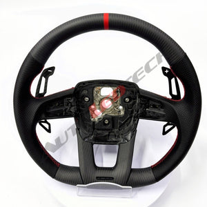Lamborghini Urus magnetic paddle shifters installed on carbon fiber steering wheel