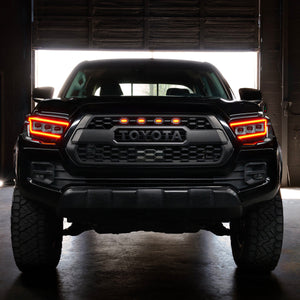 Tacoma with ORACLE Lensless headlights illuminated at night